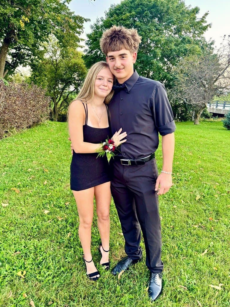 Colin in a black suit and bowtie at prom