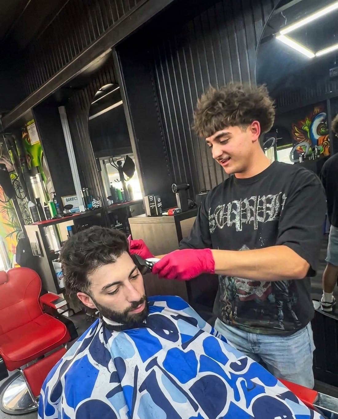 Colin Schwartz cutting a client at Boomin' Barbershop in Bay View
