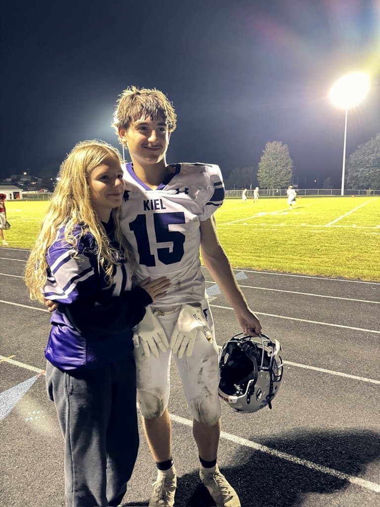 Colin in his Kiel Raiders #15 football jersey at a night game